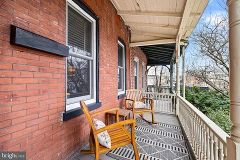 a view of a balcony with chairs