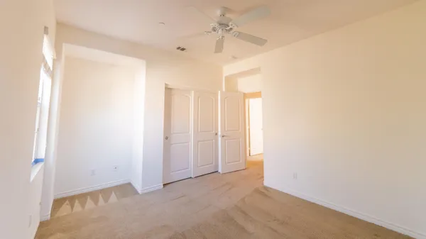 a spacious bathroom with a tub sink shower and two mirror