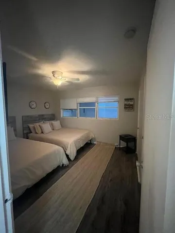 a bedroom with a bed and a walk in closet