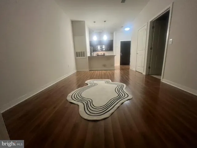 a kitchen with stainless steel appliances granite countertop a sink and a stove top oven