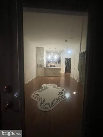 a view of a livingroom with furniture and a mirror