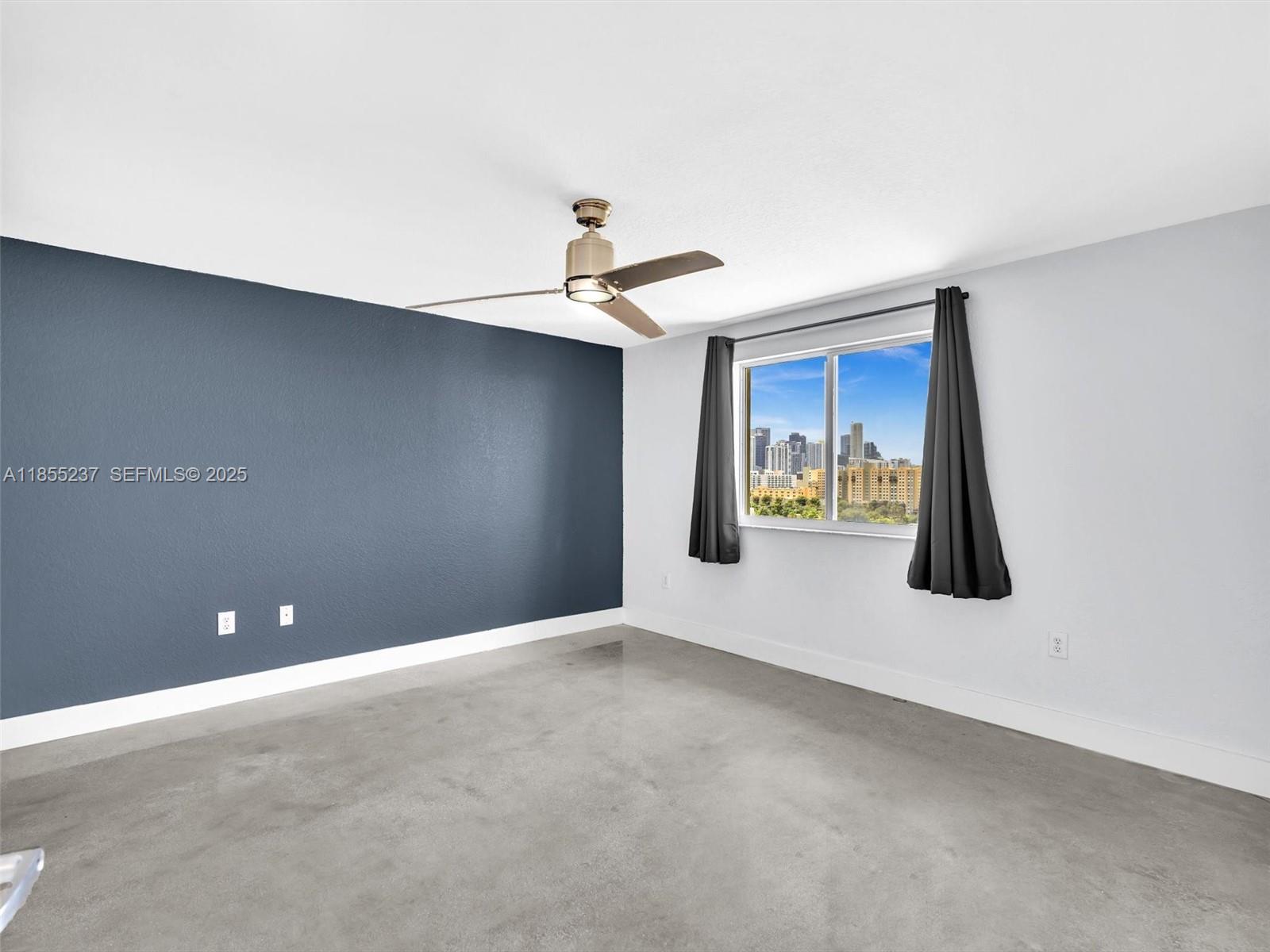 816 Northwest 11th Street, Unit 1208 Miami, FL 33136 - Photo 21 of 49 a view of an empty room with a window