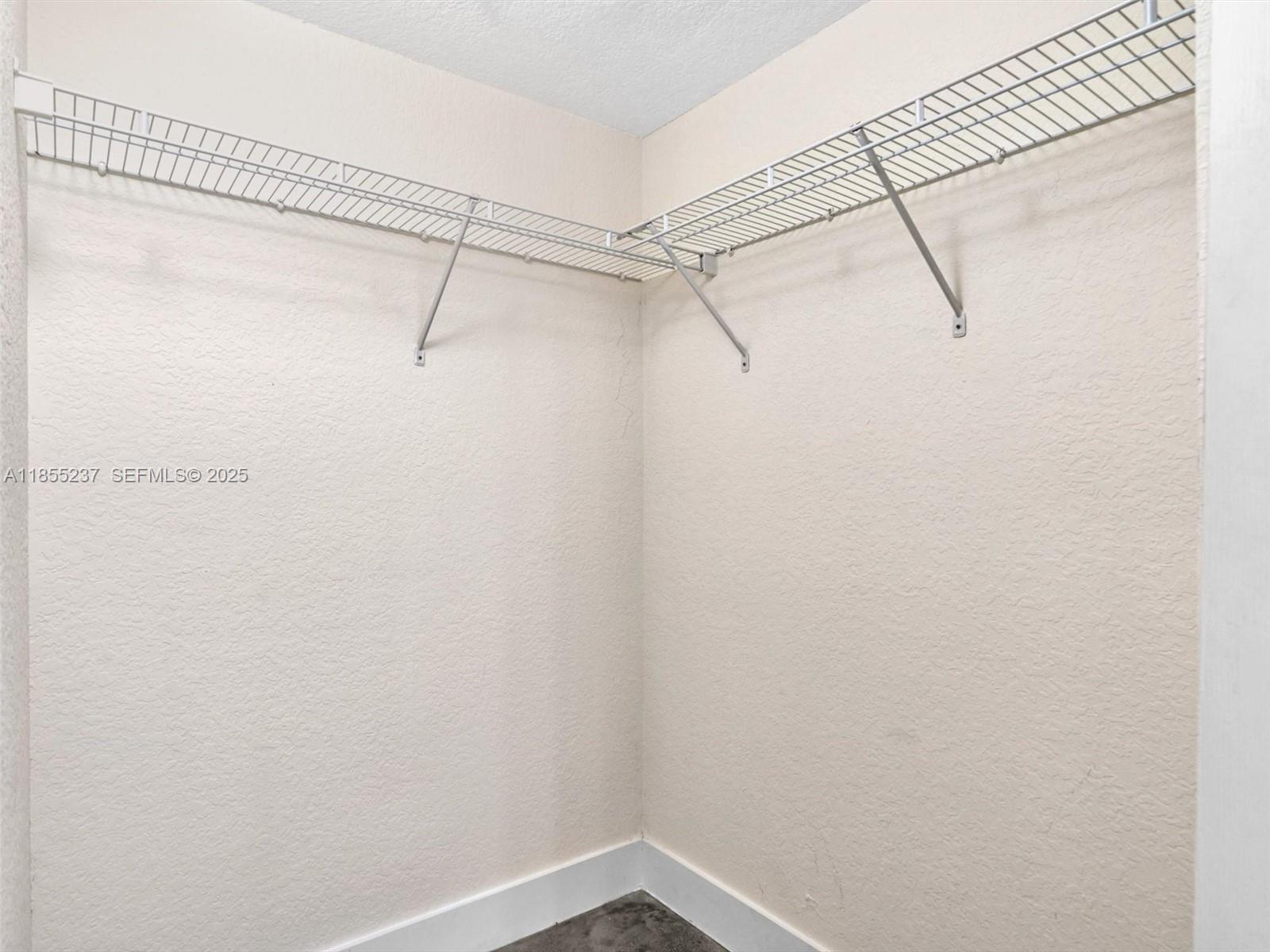 816 Northwest 11th Street, Unit 1208 Miami, FL 33136 - Photo 25 of 49 a view of a room with racks on the wall