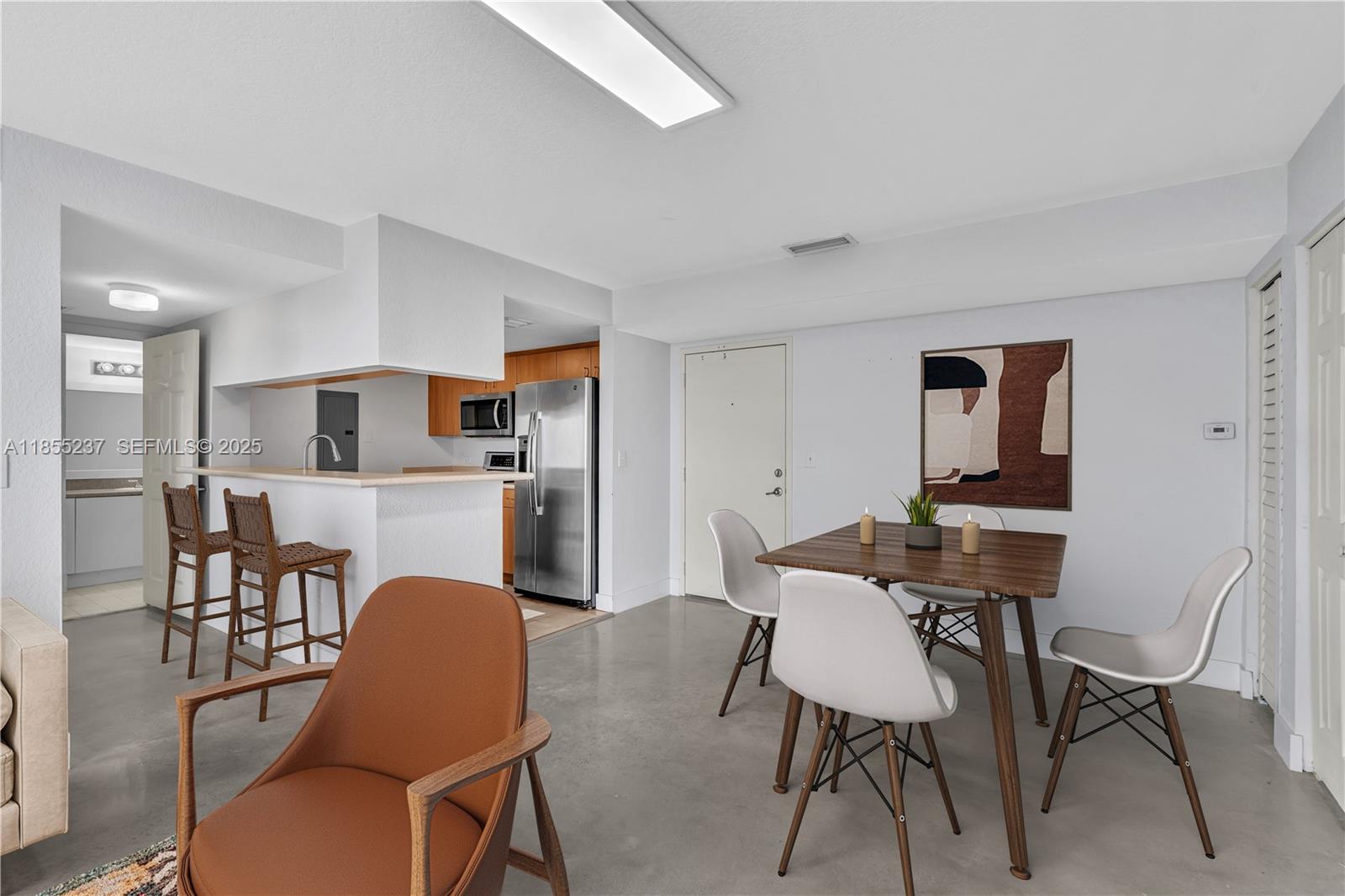 816 Northwest 11th Street, Unit 1208 Miami, FL 33136 - Photo 10 of 49 a dining room with furniture and window