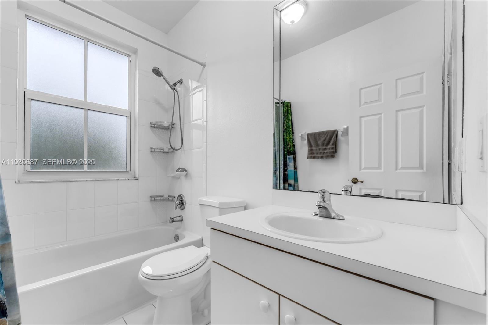 13820 Southwest 275th Street Homestead, FL 33032 - Photo 13 of 36 a bathroom with a sink a toilet and shower