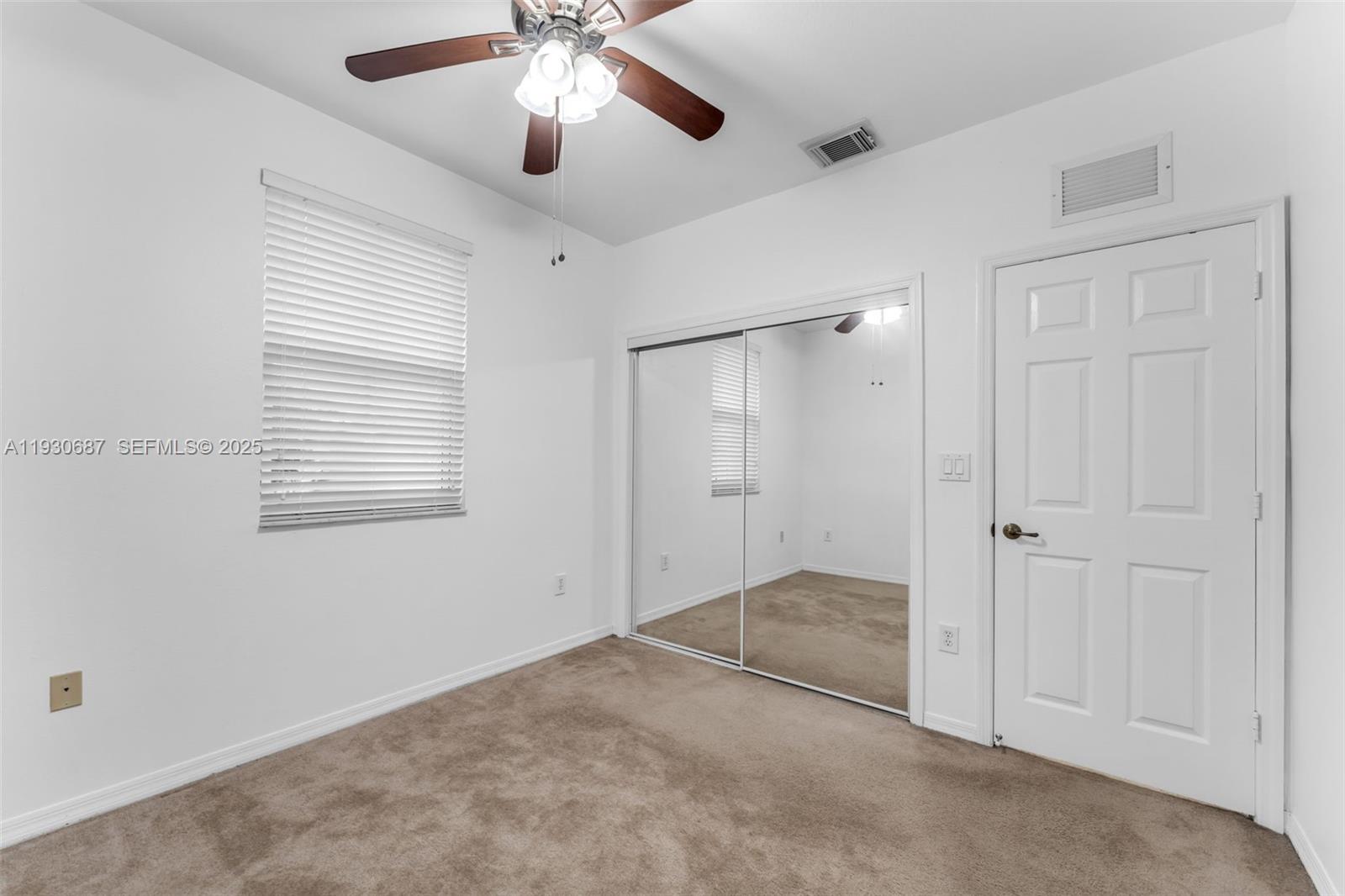 13820 Southwest 275th Street Homestead, FL 33032 - Photo 17 of 36 a view of an empty room with a window