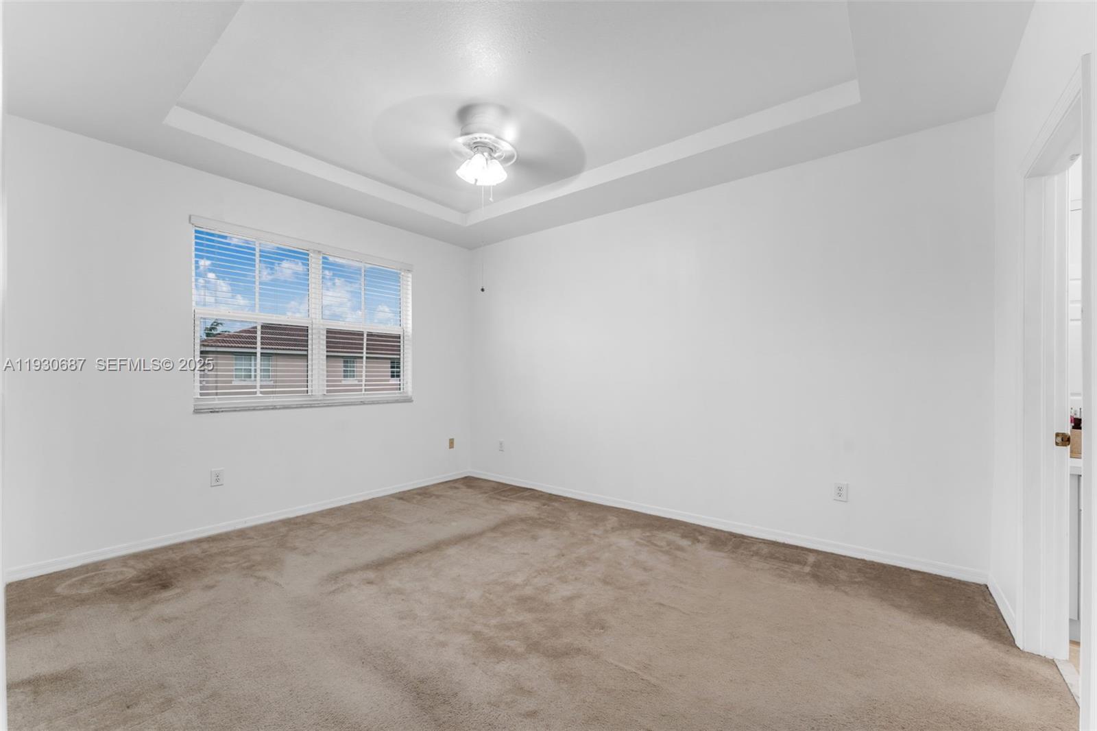 13820 Southwest 275th Street Homestead, FL 33032 - Photo 18 of 36 a view of an empty room with a window