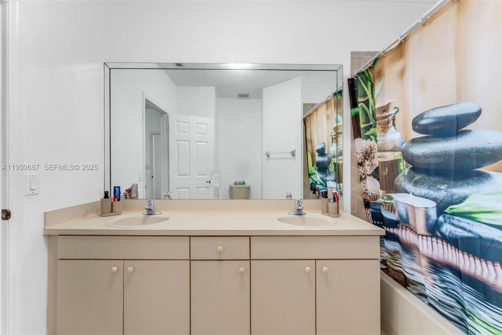 13820 Southwest 275th Street Homestead, FL 33032 - Photo 21 of 36 a bathroom with a sink and a mirror