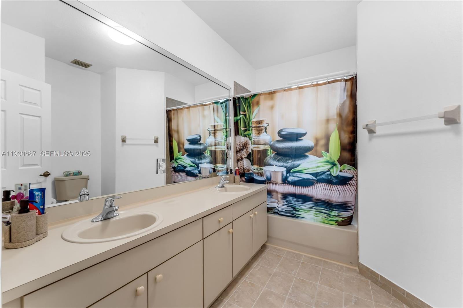 13820 Southwest 275th Street Homestead, FL 33032 - Photo 22 of 36 a bathroom with a double vanity sink and a mirror