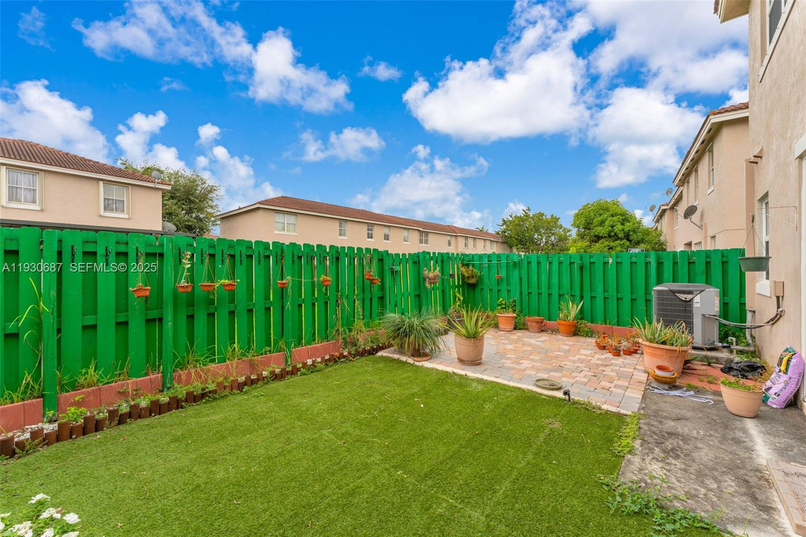 13820 Southwest 275th Street Homestead, FL 33032 - Photo 24 of 36 a backyard of a house with lots of green space