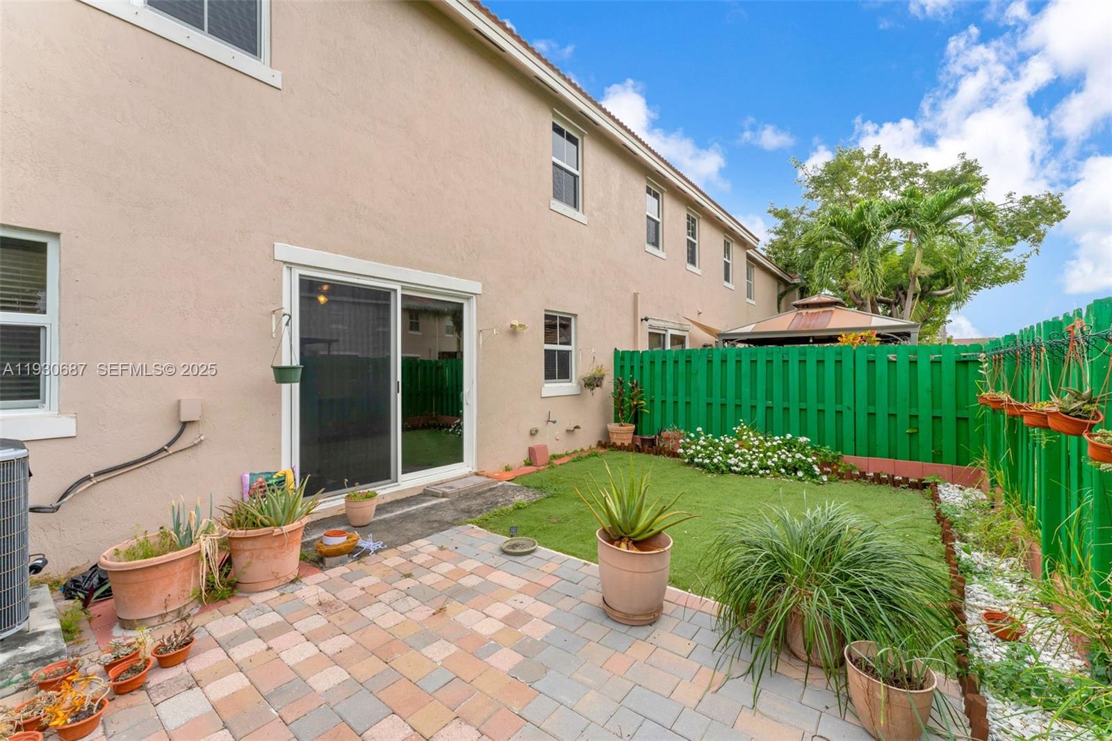 13820 Southwest 275th Street Homestead, FL 33032 - Photo 25 of 36 a view of a patio with chairs and plants