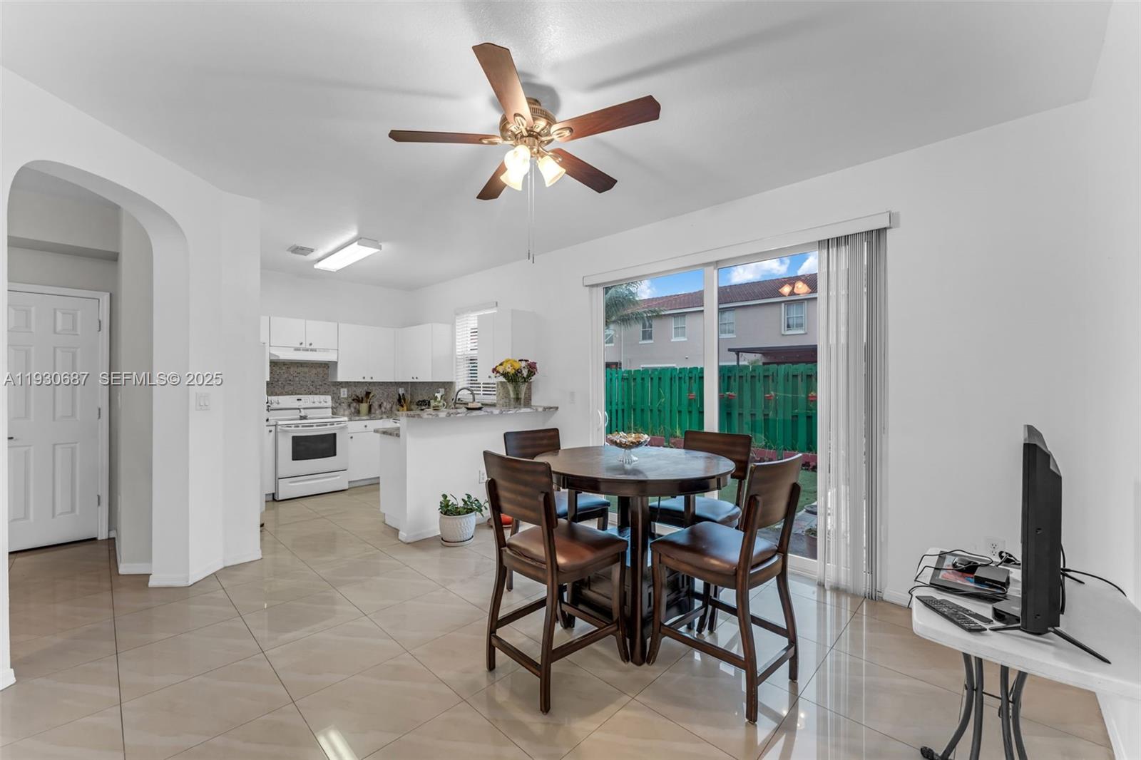 13820 Southwest 275th Street Homestead, FL 33032 - Photo 6 of 36 a view of a dining room with furniture and a window