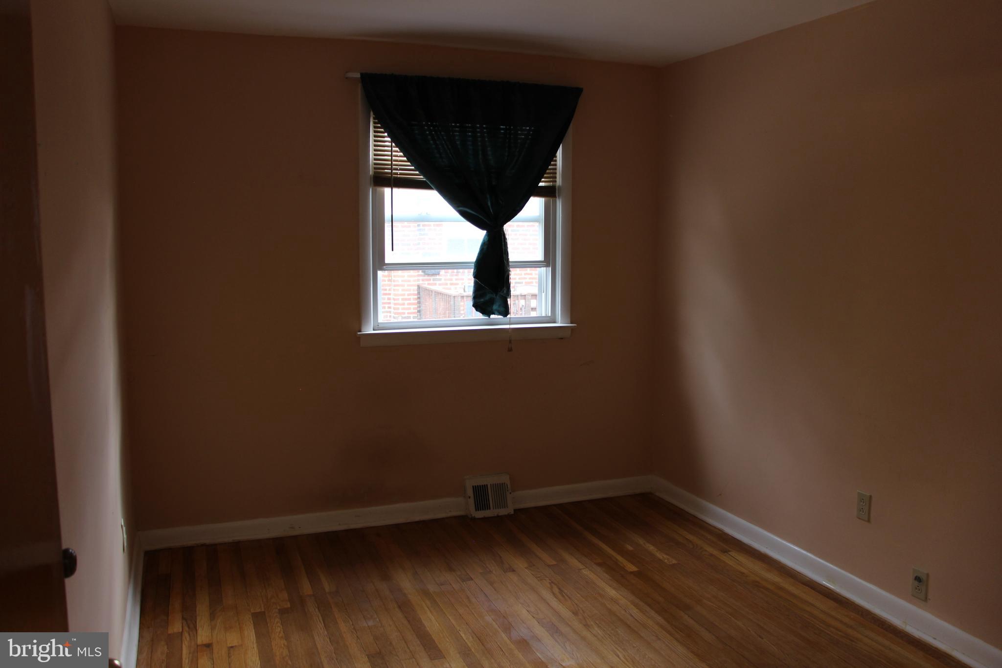 635 Colebrook Road Philadelphia, PA 19115 - Photo 24 of 31 an empty room with wooden floor and windows