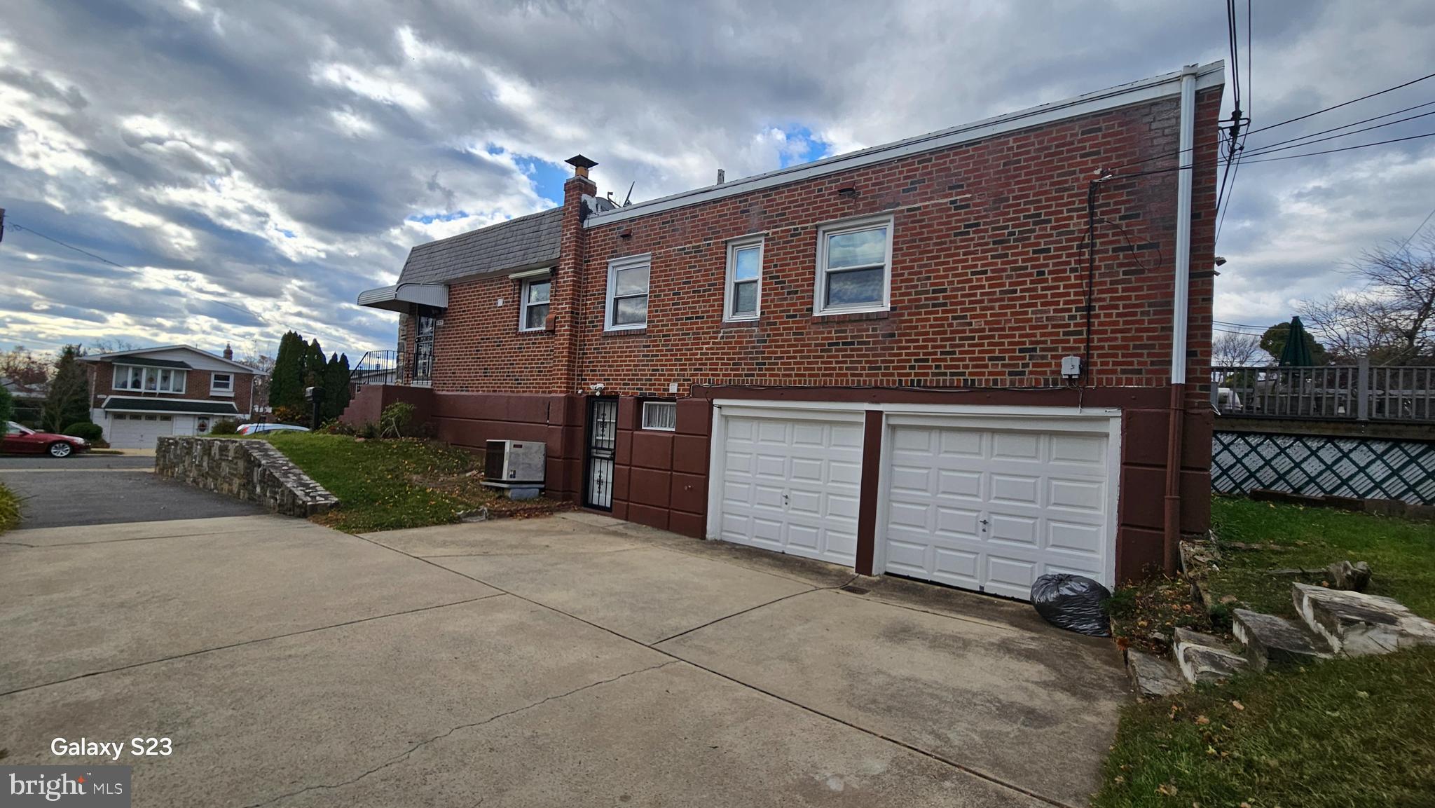 635 Colebrook Road Philadelphia, PA 19115 - Photo 31 of 31 a front view of a house with a yard