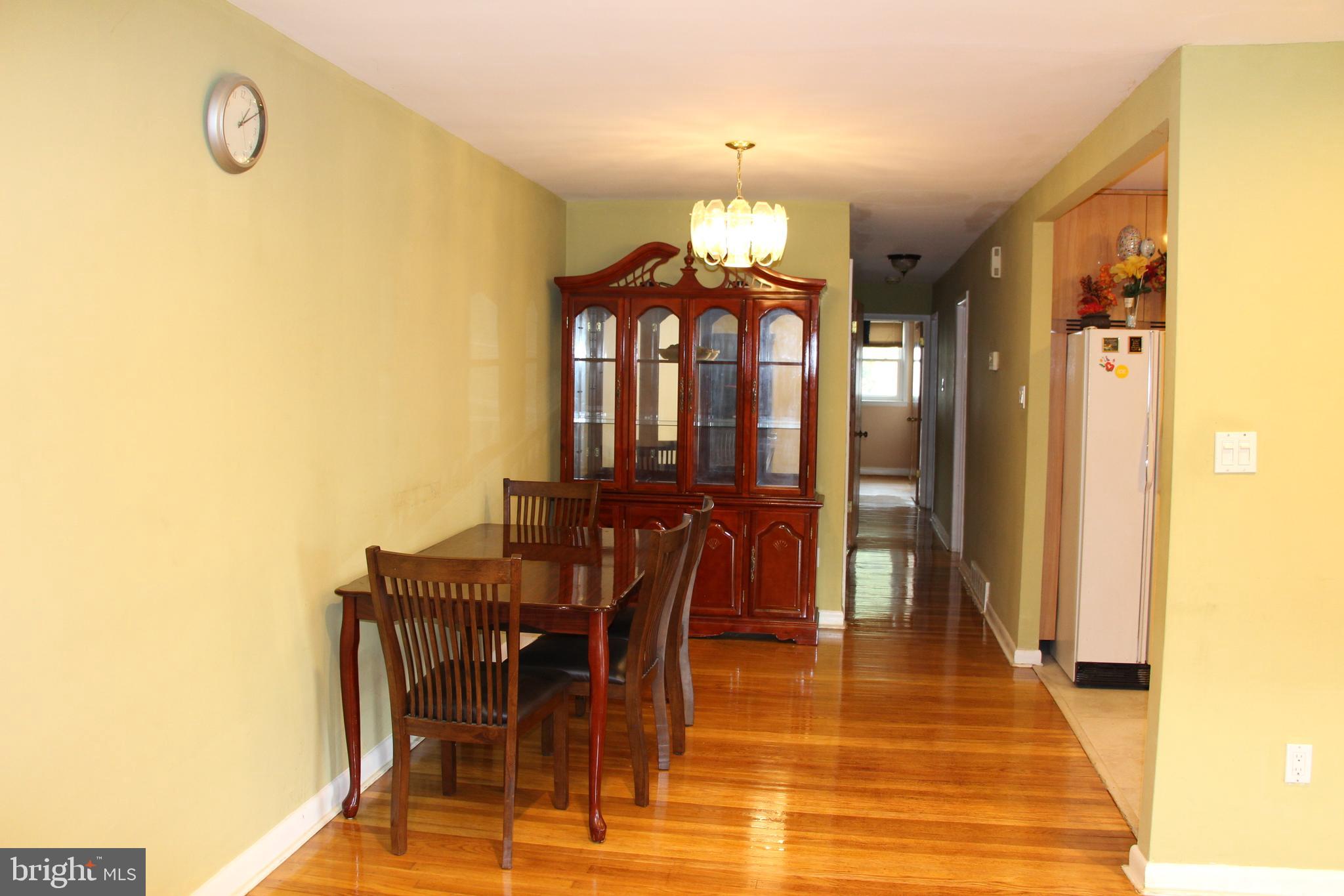 635 Colebrook Road Philadelphia, PA 19115 - Photo 7 of 31 a view of a dining room with furniture and a chandelier