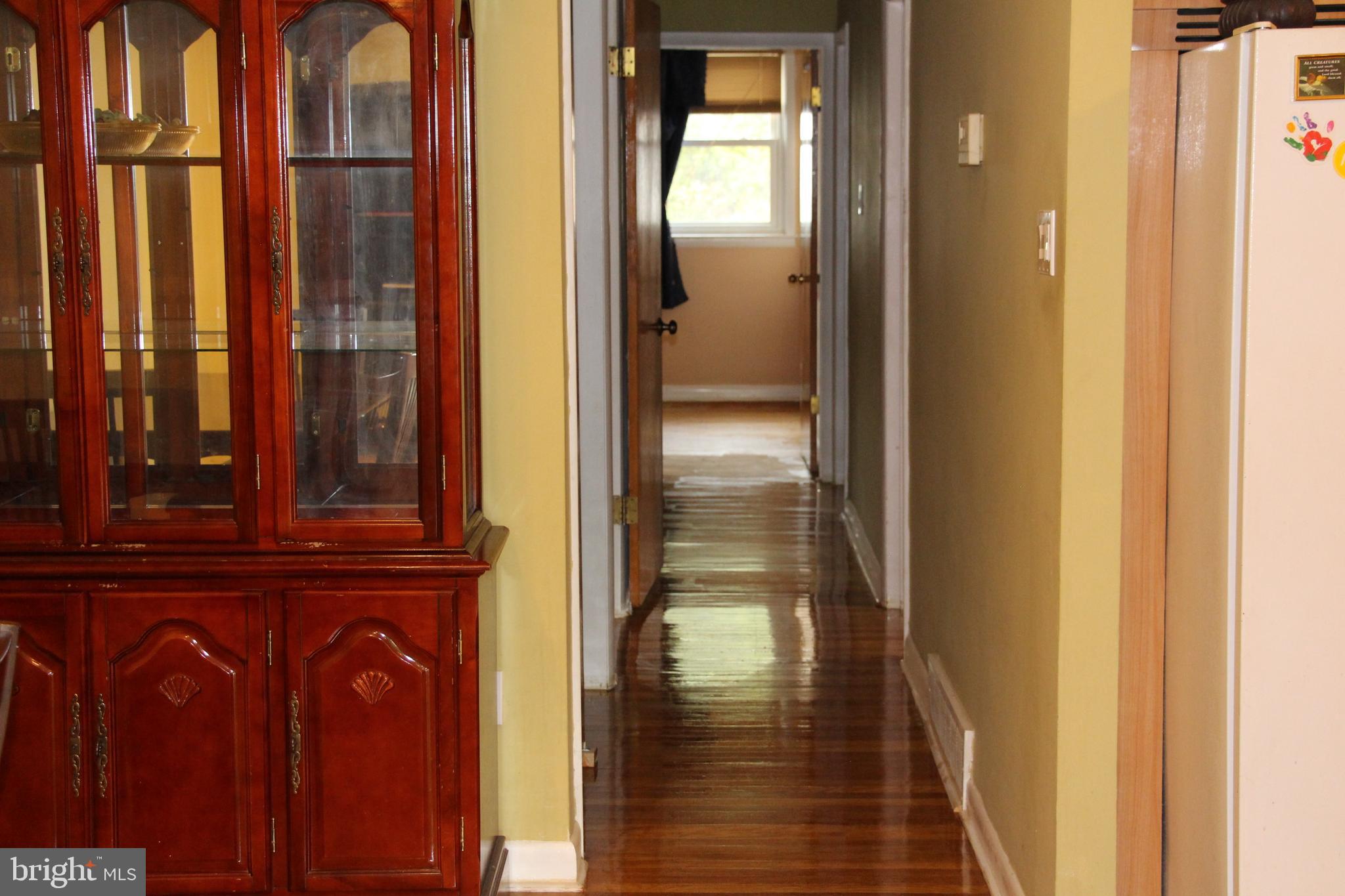 635 Colebrook Road Philadelphia, PA 19115 - Photo 9 of 31 a view of a hallway with wooden floor and windows