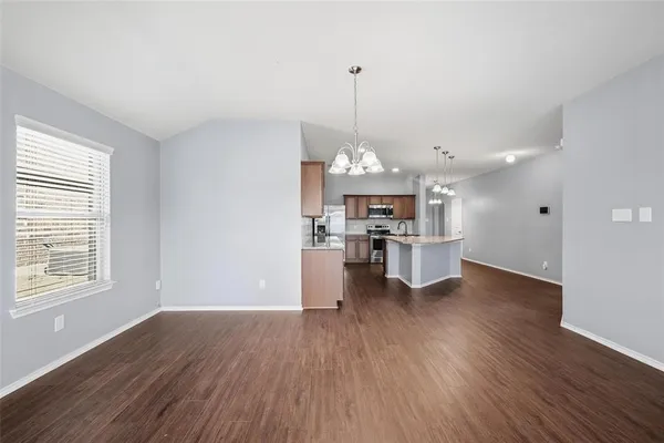 a view of a kitchen with microwave and stove