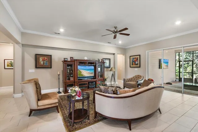a view of a livingroom with furniture and windows