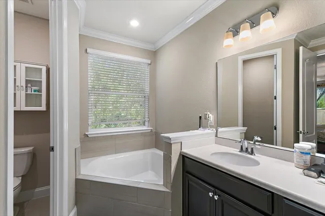 a bathroom with a double vanity sink mirror and double