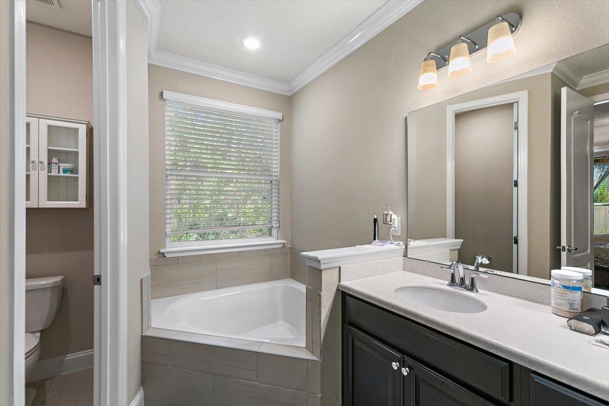 2996 Las Calinas Boulevard St. Augustine, FL 32095 - Photo 16 of 31 a bathroom with a tub sink and mirror
