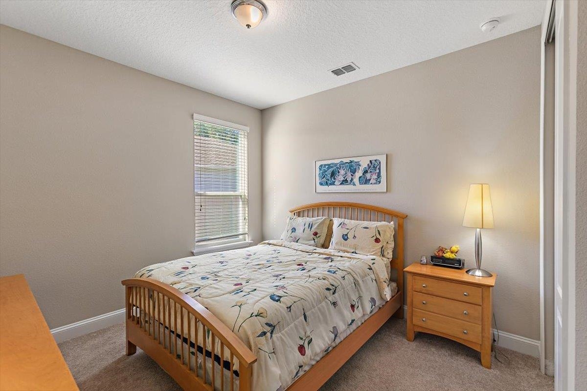 2996 Las Calinas Boulevard St. Augustine, FL 32095 - Photo 17 of 31 a bedroom with a bed and a window