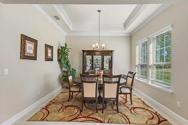a view of a dining room with furniture window and outside view