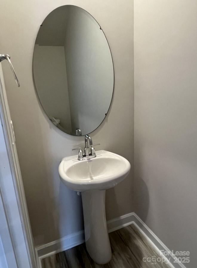 3703 Backwater Street Concord, NC 28027 - Photo 4 of 23 a bathroom with a sink and mirror