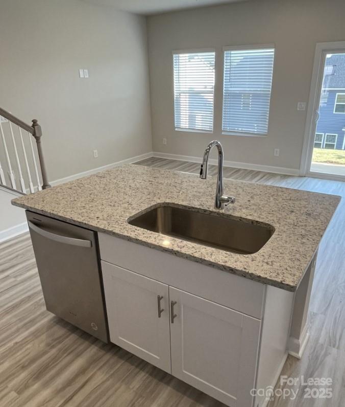 3703 Backwater Street Concord, NC 28027 - Photo 9 of 23 a kitchen with granite countertop a sink and a window