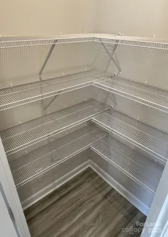 a view of a room with stairs and a rug