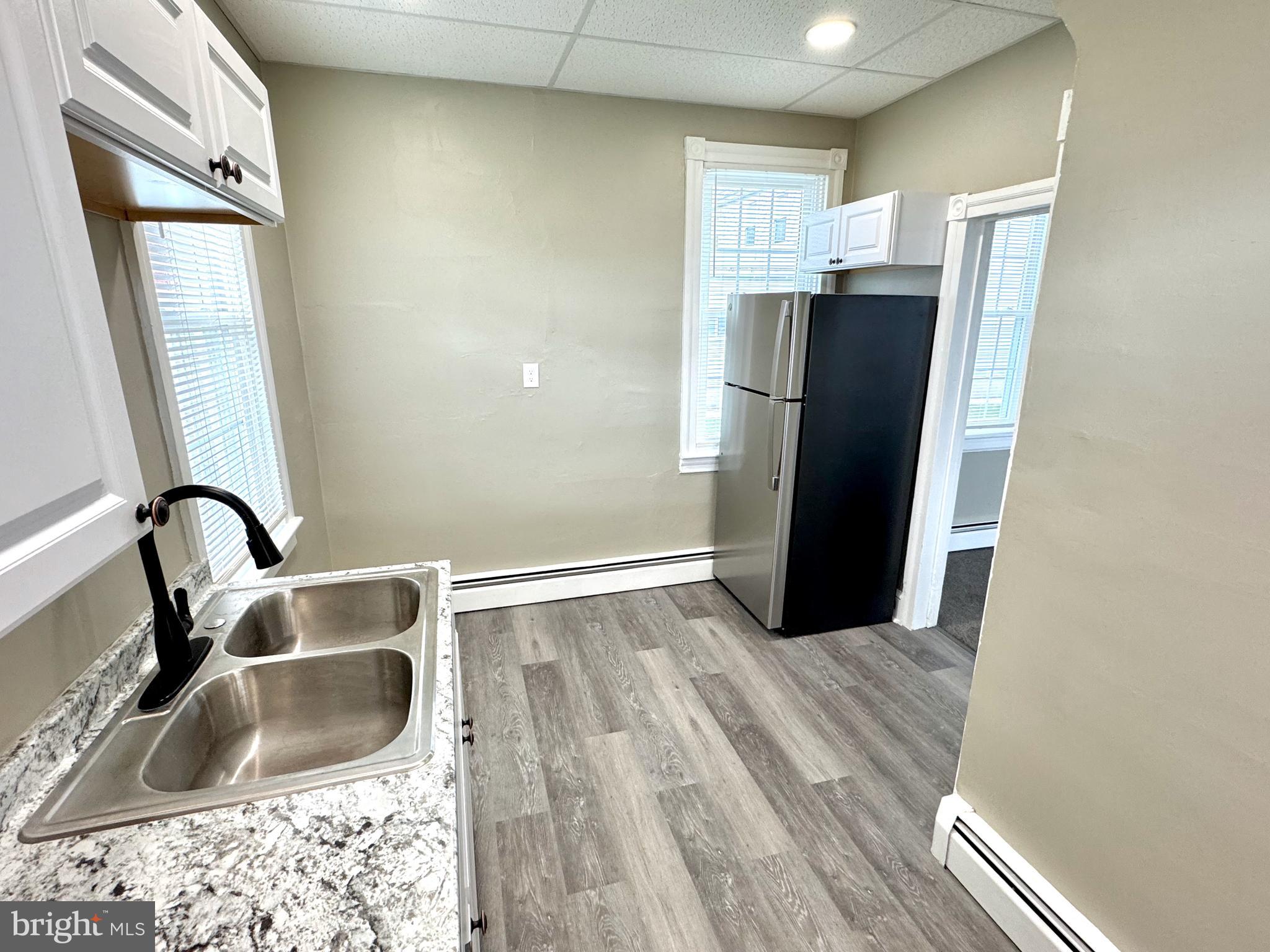 14 West Penn Avenue, Unit 3 Robesonia, PA 19551 - Photo 6 of 13 a kitchen with a refrigerator and a sink