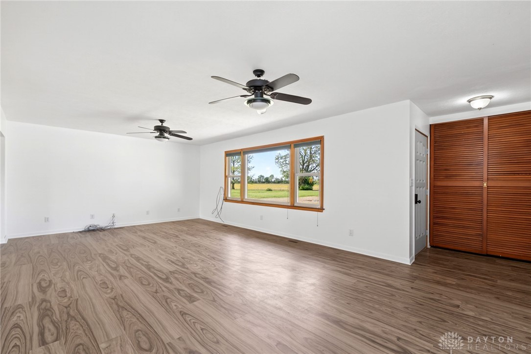 1005 Free Road New Carlisle, OH 45344 - Photo 7 of 43 This airy living space features abundant natural light and durable flooring, perfect for comfortable living.