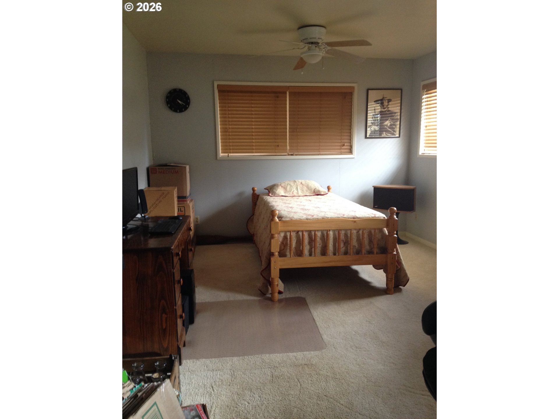 273 Crest Drive Myrtle Creek, OR 97457 - Photo 14 of 28 a bedroom with a bed and a window