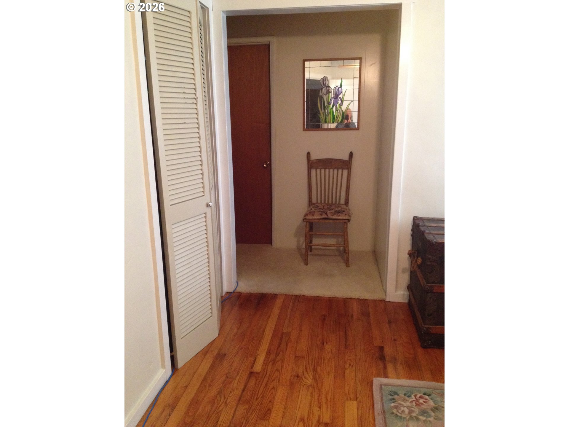273 Crest Drive Myrtle Creek, OR 97457 - Photo 15 of 28 a view of a hallway with wooden floor and a bathroom