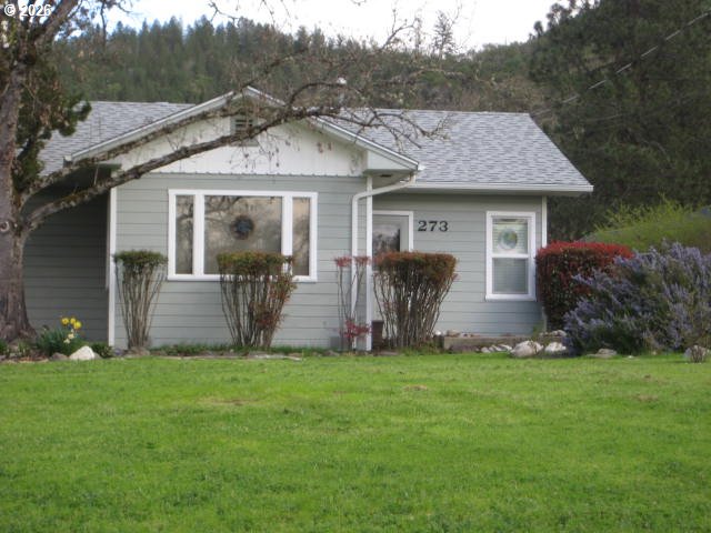 273 Crest Drive Myrtle Creek, OR 97457 - Photo 2 of 28 a view of a house with backyard and garden