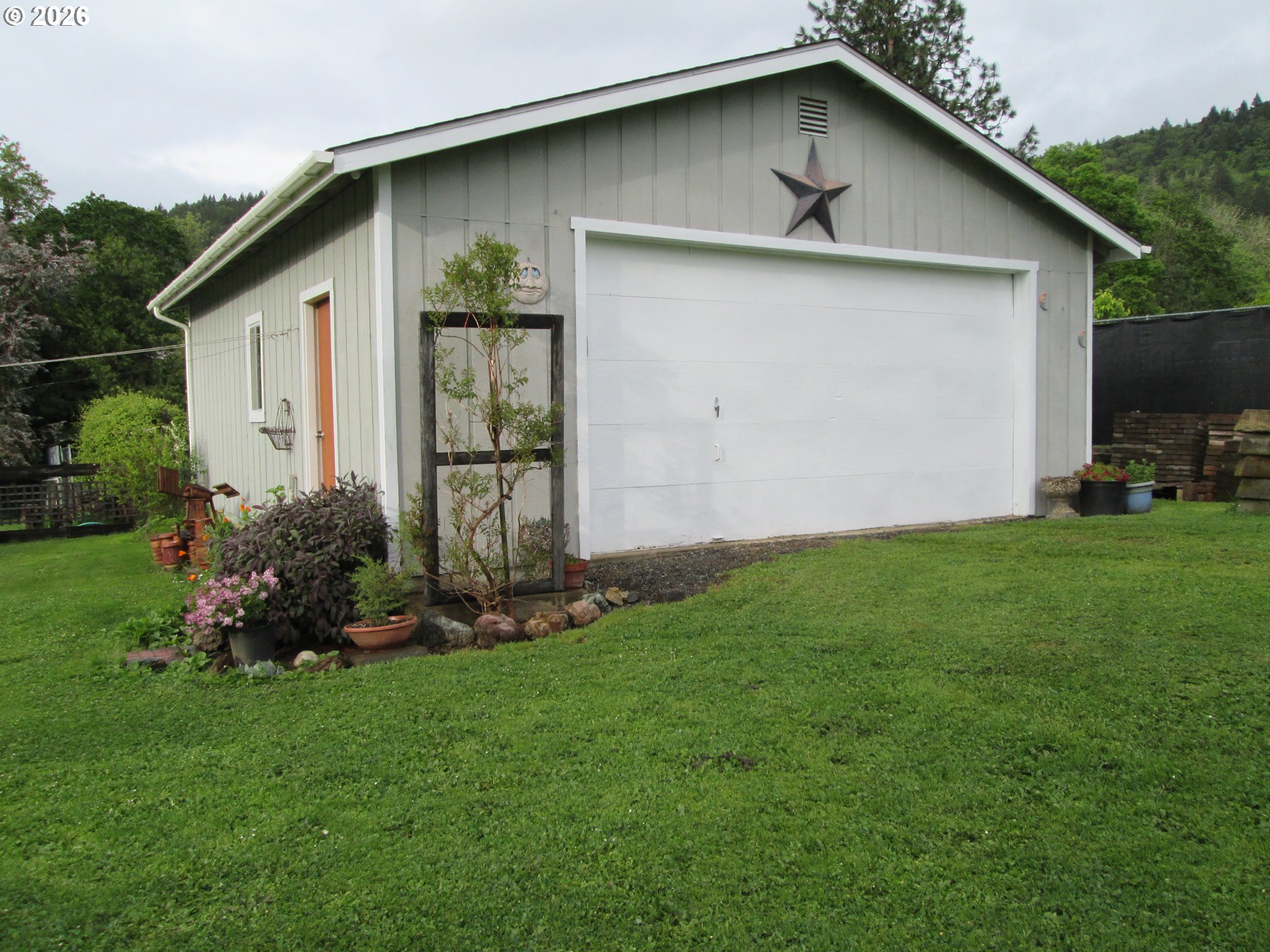 273 Crest Drive Myrtle Creek, OR 97457 - Photo 3 of 28 a front view of a house with a yard