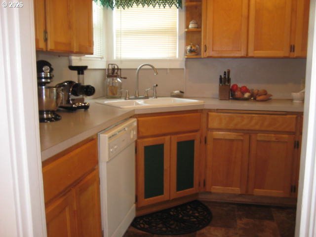 273 Crest Drive Myrtle Creek, OR 97457 - Photo 4 of 28 a kitchen with stainless steel appliances granite countertop a sink stove and cabinets