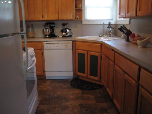 273 Crest Drive Myrtle Creek, OR 97457 - Photo 5 of 28 a kitchen with a sink cabinets and a window
