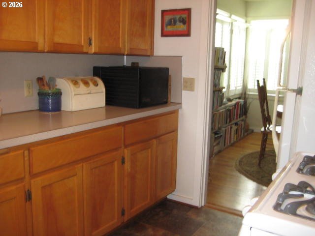 273 Crest Drive Myrtle Creek, OR 97457 - Photo 6 of 28 a kitchen with a refrigerator and a sink