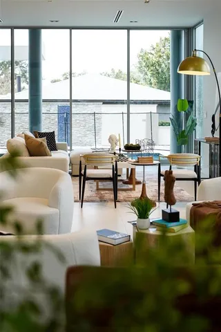 a bathroom with a glass shower door and a sink