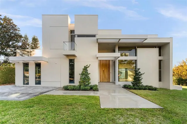 a view of kitchen with cabinets and refrigerator