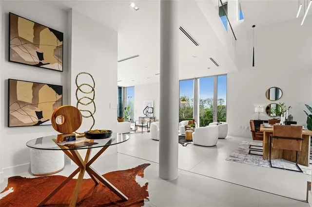 a view of a dining table and chairs