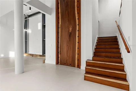 a kitchen with stainless steel appliances a large counter top