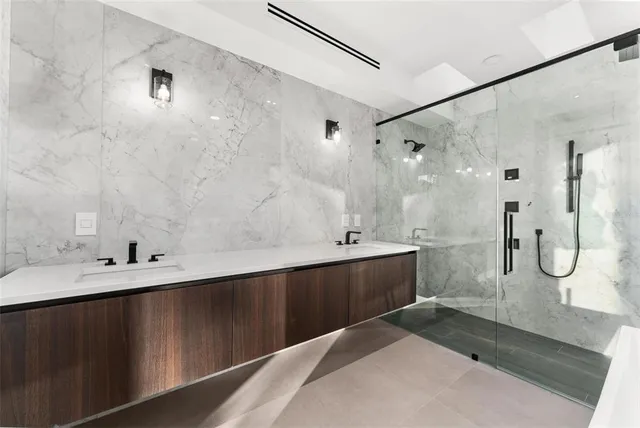 a bathroom with a sink toilet and mirror