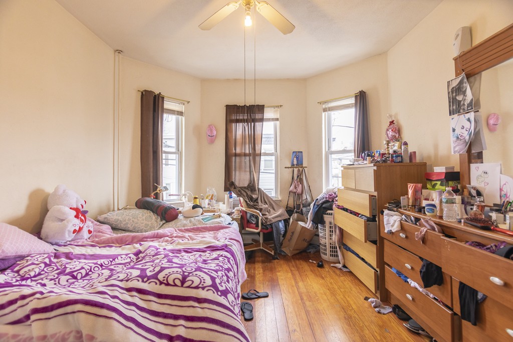 27 Watts Street Chelsea, MA 02150 - Photo 11 of 11 a bedroom with furniture and large windows