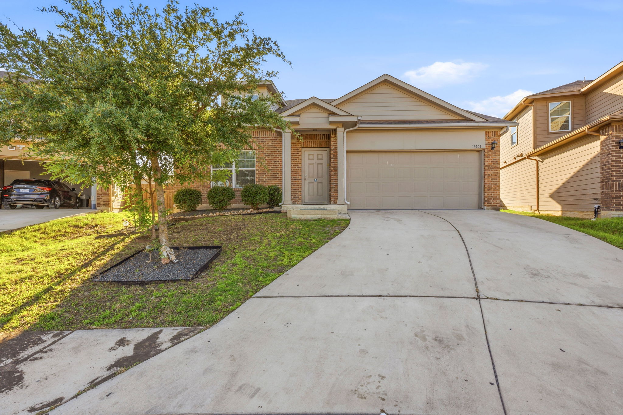 15101 Shell Bark Cove Austin, TX 78724 - Photo 2 of 26 Brick and siding exterior with a two-car garage