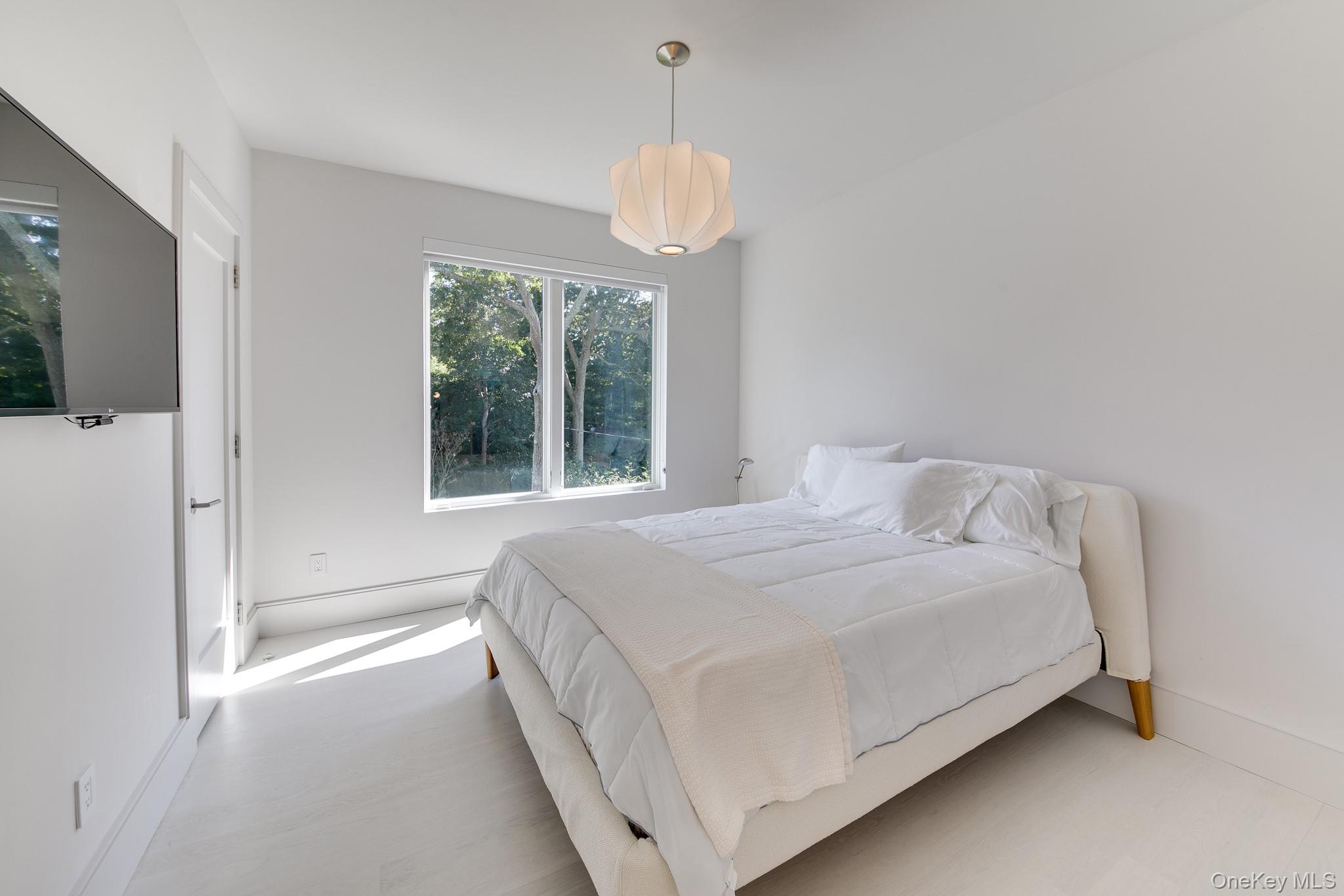 70 Cove Hollow Road East Hampton, NY 11937 - Photo 20 of 21 Bedroom with baseboards