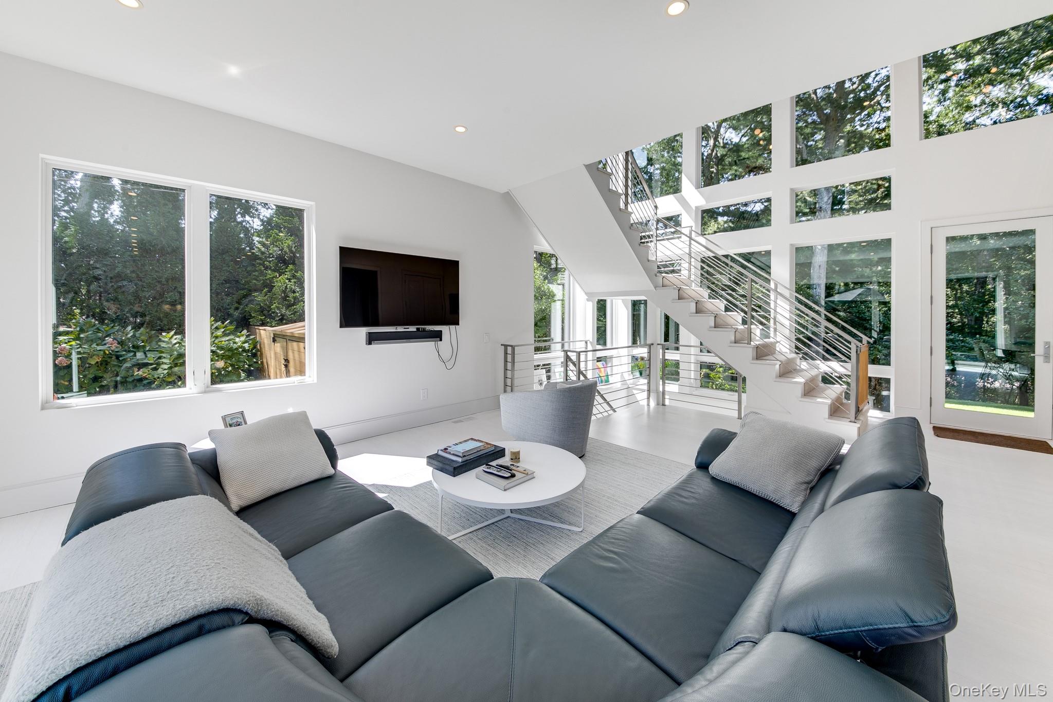 70 Cove Hollow Road East Hampton, NY 11937 - Photo 9 of 21 Living room featuring recessed lighting and stairway