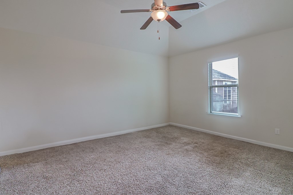 3040 Positano Loop Bryan, TX 77808 - Photo 13 of 20 a view of an empty room with a window
