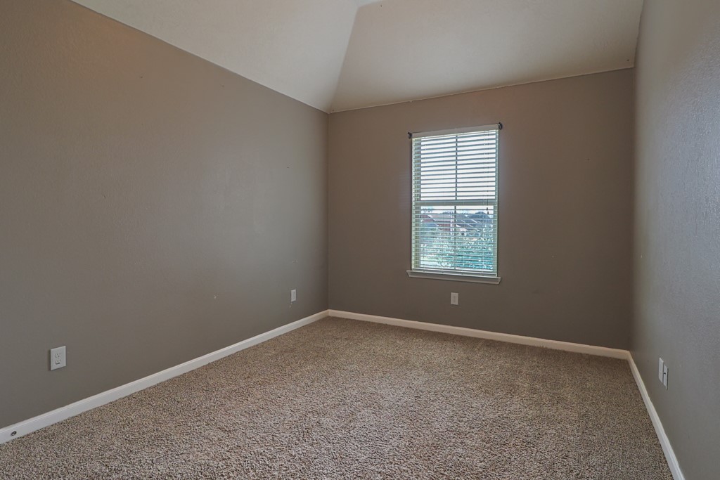 3040 Positano Loop Bryan, TX 77808 - Photo 16 of 20 an empty room with a window