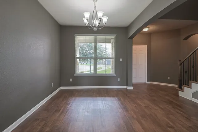 a open kitchen with sink cabinets and wooden floor
